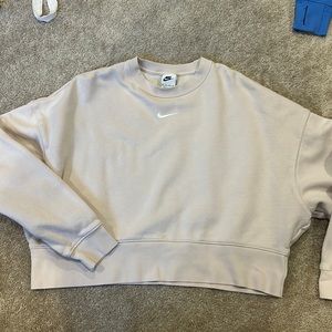 Beige colored Nike cropped crew neck